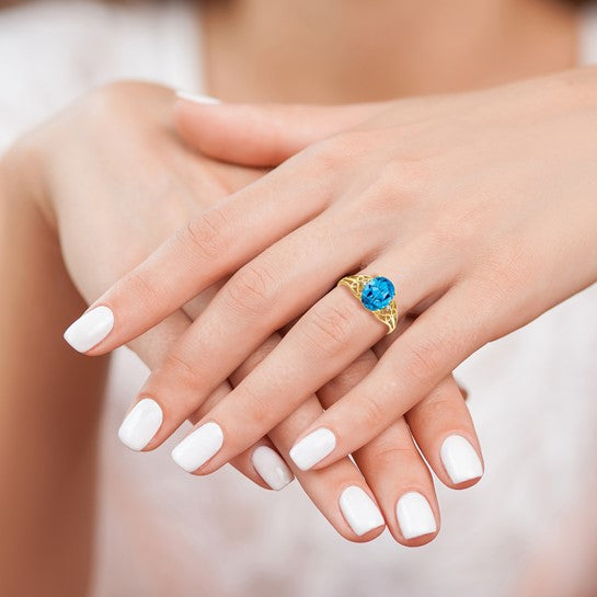 14k 9x7mm Oval Blue Topaz and A Diamond Filigree Ring